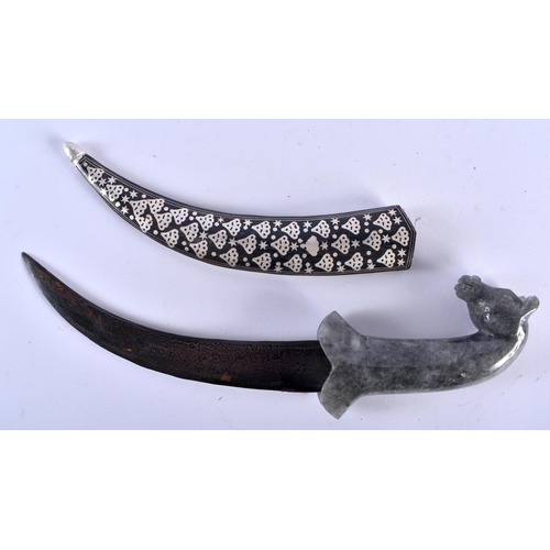 623 - A MIDDLE EASTERN CARVED TIGERS EYE HORSE HEAD HANDLED NIELLO DAGGER. 35 cm long.