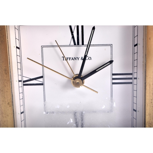 636 - A TIFFANY & CO BRASS MANTEL CLOCK. 10 cm x 10 cm.