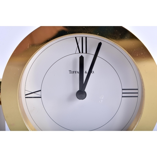 637 - A TIFFANY & CO BRASS MANTEL CLOCK. 10 cm x 14 cm.