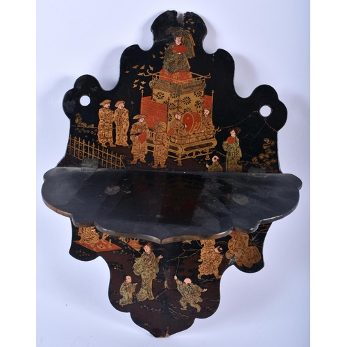 640 - AN ANTIQUE COUNTRY HOUSE BLACK LACQUER FAN together with a pin cushion etc. Largest 34 cm x 18 cm. (... 