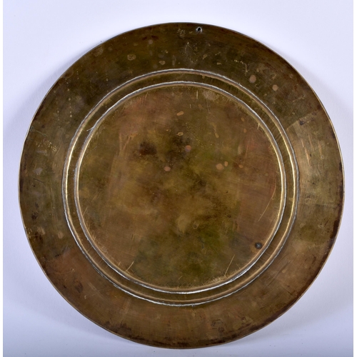 645 - AN ANTIQUE INDIAN BRONZE AND SILVER REPOUSSE DISH. 337 grams. 24 cm diameter.