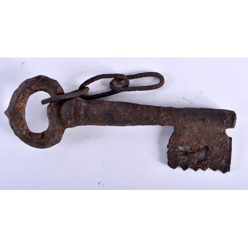 649 - A LARGE ANTIQUE IRON KEY. 27 cm wide.