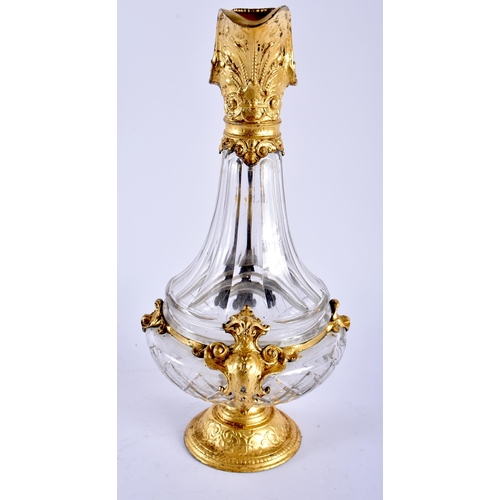 650 - AN ANTIQUE GILT MOUNTED GLASS CLARET JUG. 35 cm high.