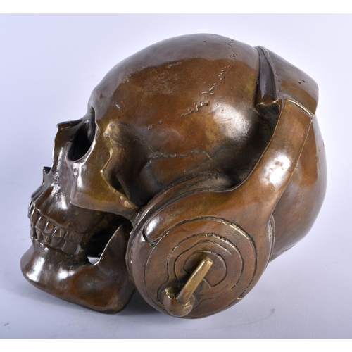 652 - A BRONZE SKELETON DJ SCULPTURE. 18 cm x 14 cm.