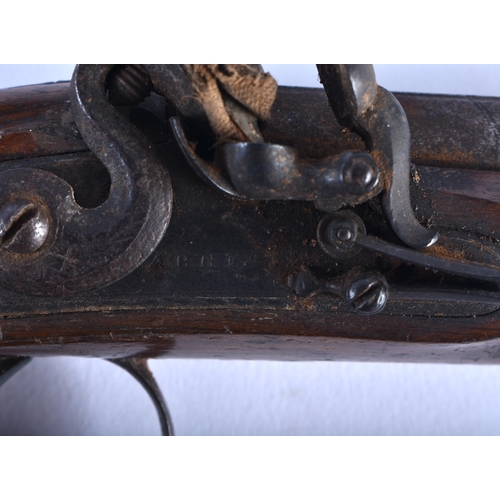 653 - A PAIR OF ANTIQUE IRISH PISTOLS by Harris of Clonmel. 19 cm long.