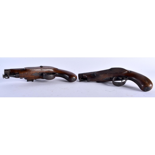 653 - A PAIR OF ANTIQUE IRISH PISTOLS by Harris of Clonmel. 19 cm long.