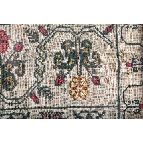 655 - A FRAMED ANTIQUE EMBROIDERED SAMPLER depicting animals and foliage. 36 cm square.