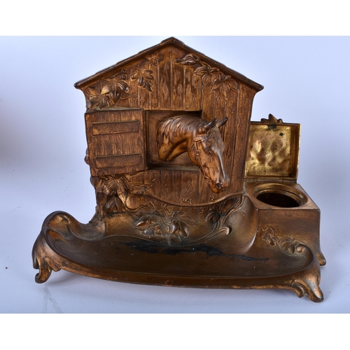 663 - AN UNUSUAL ANTIQUE BISCUIT TIN MONEY BOX together with a spelter equestrian desk stand. Largest 15 c... 