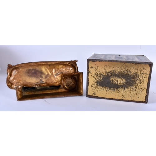 663 - AN UNUSUAL ANTIQUE BISCUIT TIN MONEY BOX together with a spelter equestrian desk stand. Largest 15 c... 