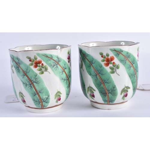 66 - TWO RARE 18TH CENTURY WORCESTER FLUTED COFFEE CUPS and one matching saucer, painted with flowers and... 