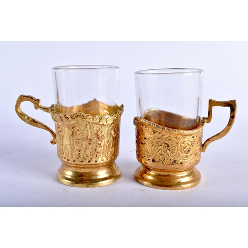 677 - AN EARLY 20TH CENTURY PERSIAN BRONZE DRINKS SET with matching tray. 27 cm diameter. (qty)