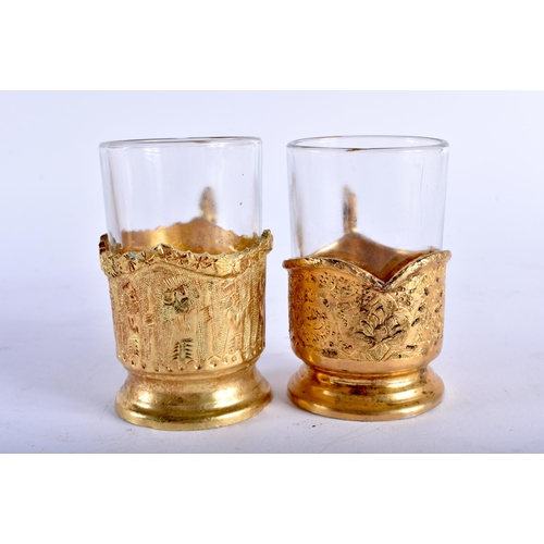 677 - AN EARLY 20TH CENTURY PERSIAN BRONZE DRINKS SET with matching tray. 27 cm diameter. (qty)