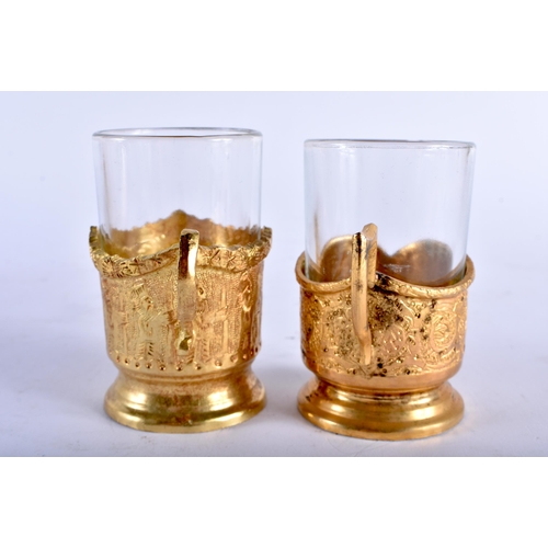 677 - AN EARLY 20TH CENTURY PERSIAN BRONZE DRINKS SET with matching tray. 27 cm diameter. (qty)