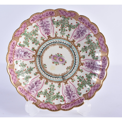 68 - AN 18TH CENTURY WORCESTER PORCELAIN FLUTED TEACUP AND SAUCER painted with puce trailing flowers unde... 