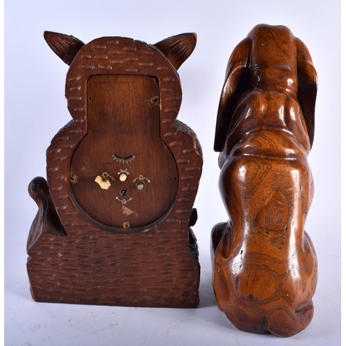 684 - A BAVARIAN BLACK FOREST OWL CLOCK together with a large wood begging hound & a rabbit mounted bottle... 