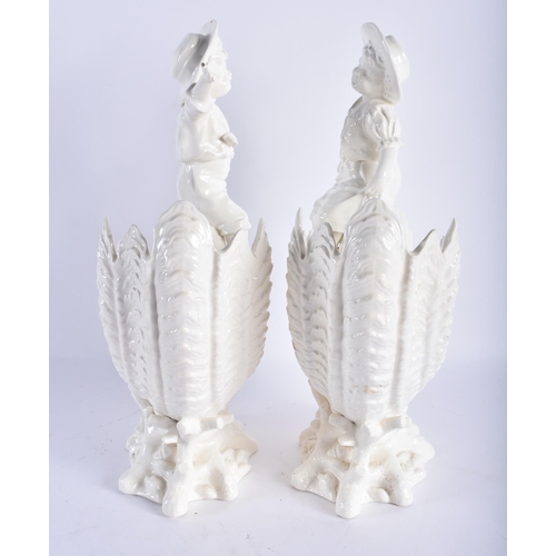 696 - A LARGE PAIR OF 19TH CENTURY CONTINENTAL CREAMWARE CORNUCOPIA VASES formed with young children. 30 c... 