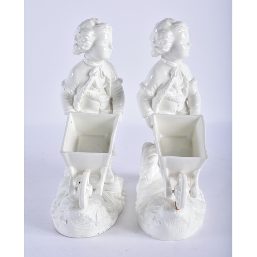 697 - A PAIR OF 19TH CENTURY ENGLISH MORTLAKE CREAMWARE VASES formed with figures pulling wheelbarrow. 25c... 