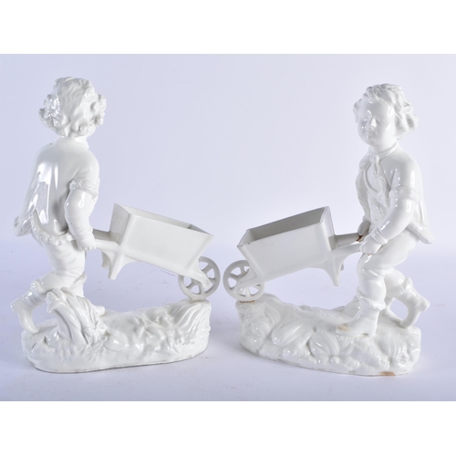 697 - A PAIR OF 19TH CENTURY ENGLISH MORTLAKE CREAMWARE VASES formed with figures pulling wheelbarrow. 25c... 