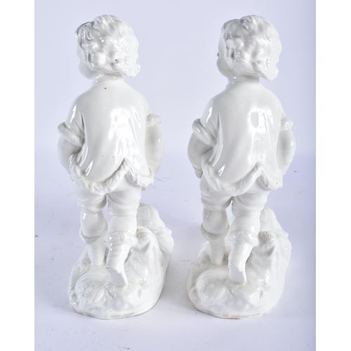 697 - A PAIR OF 19TH CENTURY ENGLISH MORTLAKE CREAMWARE VASES formed with figures pulling wheelbarrow. 25c... 