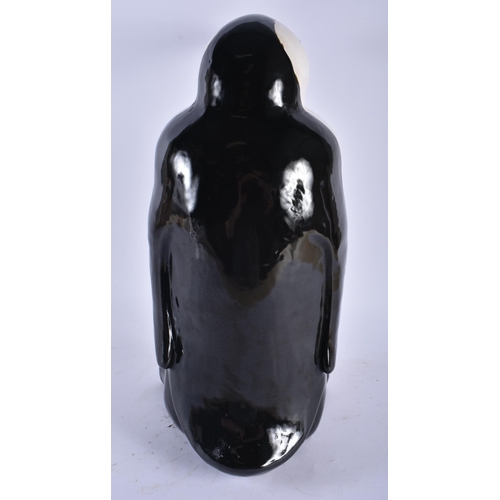 740 - A LARGE CONTINENTAL CERAMIC FIGURE OF A PENGUIN. 44 cm x 17 cm.