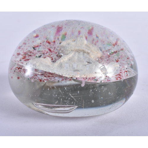 744 - AN UNUSUAL SULPHIDE GLASS PAPERWEIGHT. 6.5 cm wide.