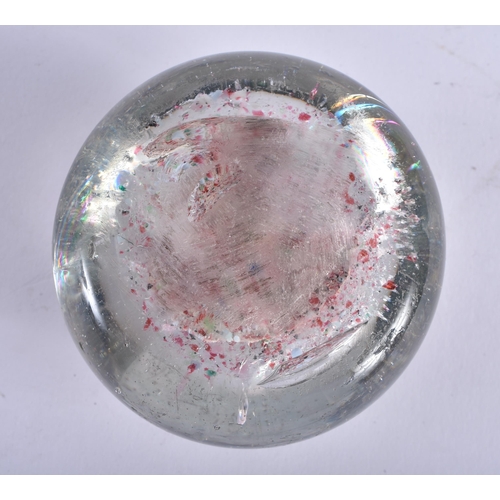 744 - AN UNUSUAL SULPHIDE GLASS PAPERWEIGHT. 6.5 cm wide.