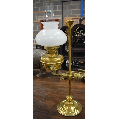 751 - A LARGE BRASS ADJUSTABLE OIL LAMP. 64 cm high.