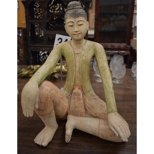 753 - A LARGE SOUTHEAST ASIAN PAINTED WOOD FIGURE OF A BUDDHA. 58 cm x 38 cm.