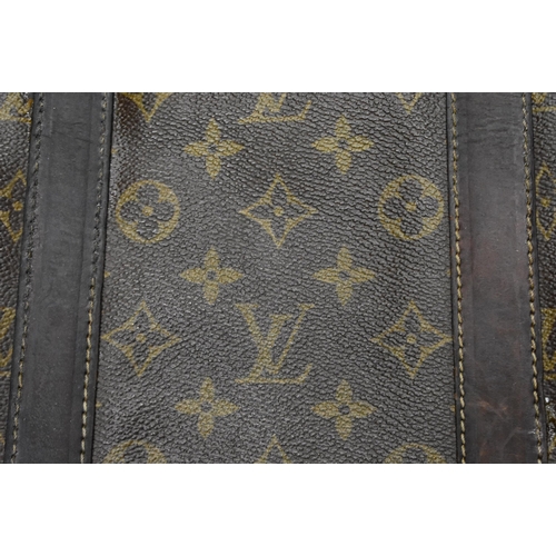 758 - A LOUIS VUITTON SHOULDER BAG. 75 cm x 35 cm inc strap.