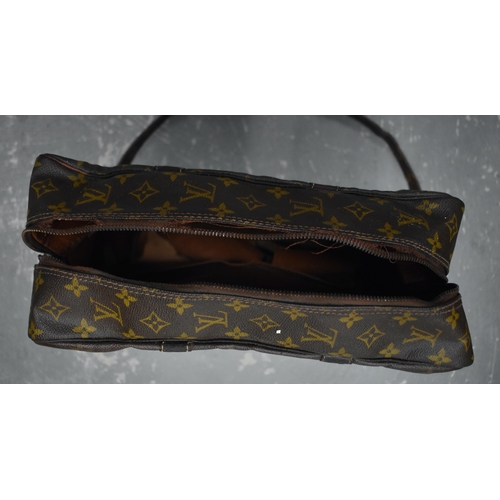 758 - A LOUIS VUITTON SHOULDER BAG. 75 cm x 35 cm inc strap.