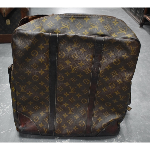 758 - A LOUIS VUITTON SHOULDER BAG. 75 cm x 35 cm inc strap.