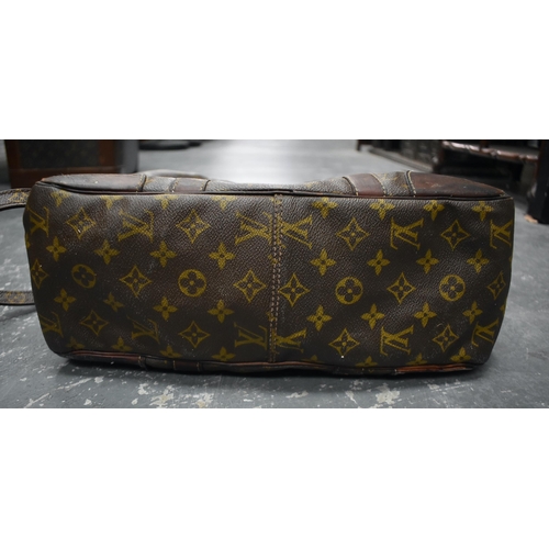 758 - A LOUIS VUITTON SHOULDER BAG. 75 cm x 35 cm inc strap.