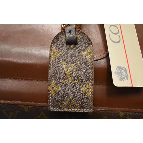 759 - A LOUIS VUITTON TRAVEL BAG. 64 cm x 48cm.