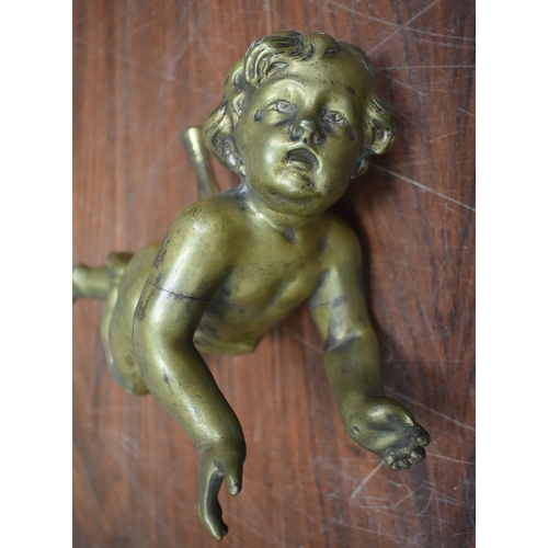 763 - THREE ANTIQUE BRONZE CHERUBS. 31 cm wide. (3)