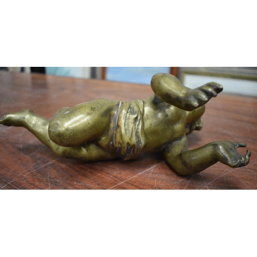 763 - THREE ANTIQUE BRONZE CHERUBS. 31 cm wide. (3)