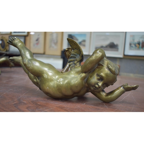 763 - THREE ANTIQUE BRONZE CHERUBS. 31 cm wide. (3)