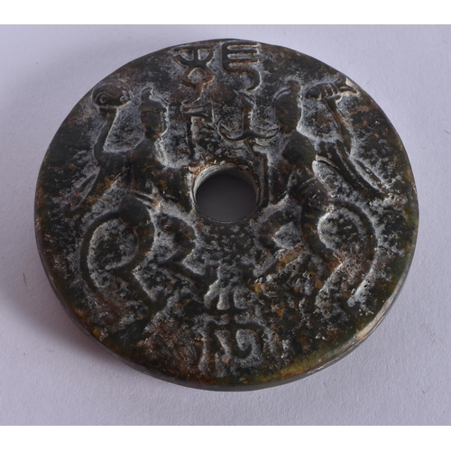 1001 - A RARE CHINESE QING DYNASTY CARVED JADE ROUNDEL decorated with figures and archaic motifs. 83.4 gram... 