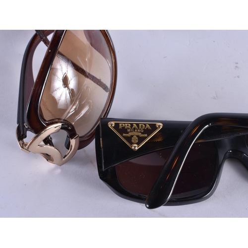 1005 - TWO PAIRS OF DESIGNER SUNGLASSES Prada & Chanel. 14.5 cm wide. (2)