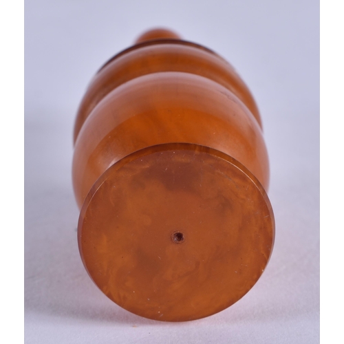 1008 - A RARE ART DECO AMBER CATALIN BAKELITE SCENT BOTTLE AND STOPPER. 18 grams. 6.25cm x 2.5 cm.