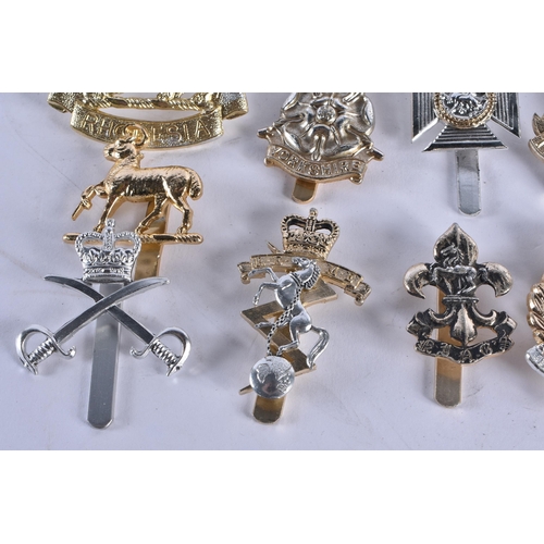 1014 - ASSORTED MILITARY CAP BADGES etc. 130 grams. (qty)