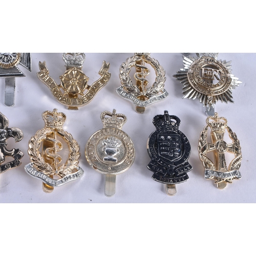 1014 - ASSORTED MILITARY CAP BADGES etc. 130 grams. (qty)