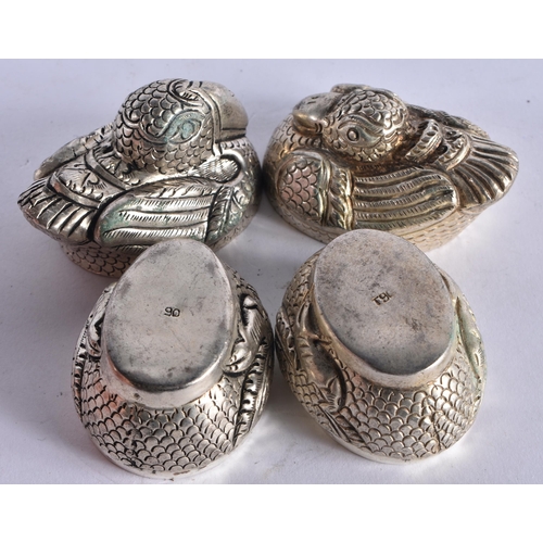 1022 - A PAIR OF CAMBODIAN WHITE METAL BIRD BOXES AND COVERS. 69.4 grams. Largest 5.5 cm x 4 cm.