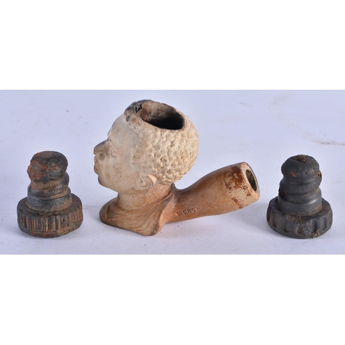 1035 - AN UNUSUAL ANTIQUE CHARLES CROP LONDON POTTERY PIPE together with two early bottle tops. Largest 7.5... 