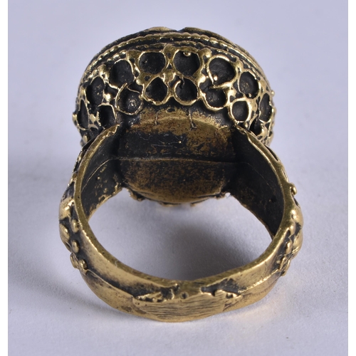 1037 - AN EARLY ISLAMIC MIDDLE EASTERN YELLOW METAL RING. R. 12.5 grams.