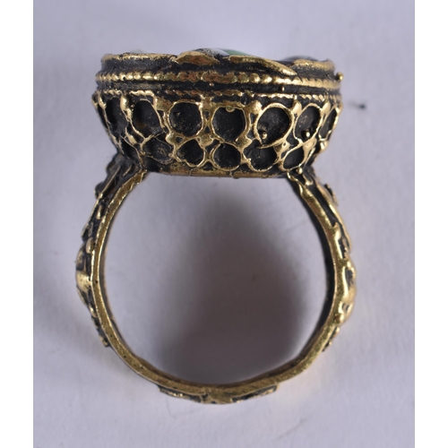 1037 - AN EARLY ISLAMIC MIDDLE EASTERN YELLOW METAL RING. R. 12.5 grams.