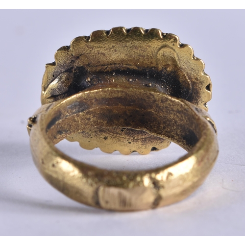 1042 - A MIDDLE EASTERN ISLAMIC YELLOW METAL RING. S. 13.8 grams.