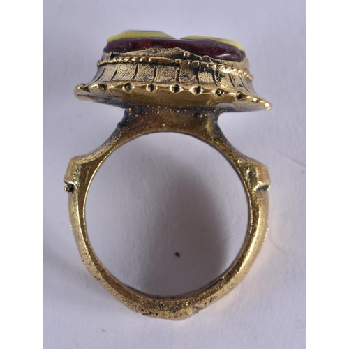 1042 - A MIDDLE EASTERN ISLAMIC YELLOW METAL RING. S. 13.8 grams.