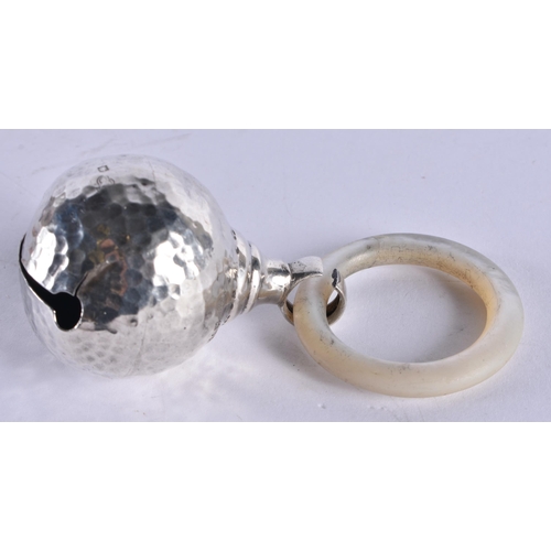 1048 - AN ANTIQUE SILVER HAMMERED SILVER TEETHING RING together with a white metal rabbit ring. London 1912... 