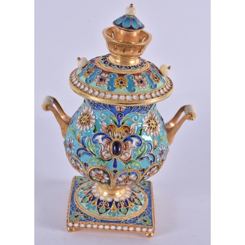 1066 - A Continental Silver Gilt and Enamel Samovar. 161 grams. 10.5 cm x 7.25cm x 7 cm.