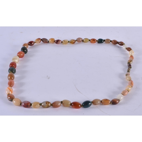 1071 - AN AGATE NECKLACE. 101 grams. 68 cm long.